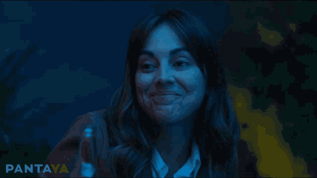 a woman in a dark room with the word pantaya on the bottom right