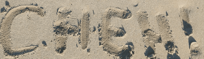 the word cash is written in the sand on the beach