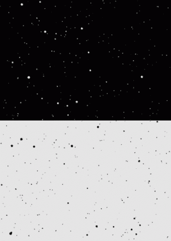 a black and white image of a snowy sky