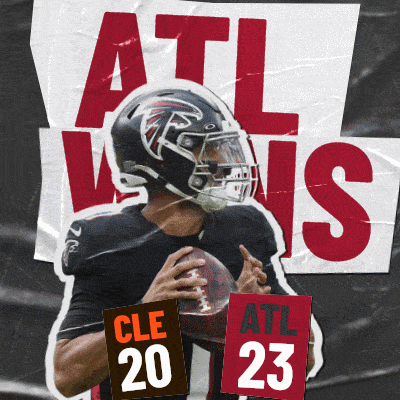 a football player holding a sign that says cle 20 on it