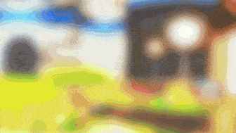 a blurry picture of a person 's face with a yellow circle in the middle