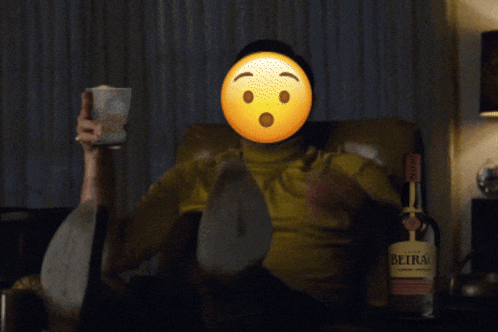 a bottle of beira sits on a table next to a man