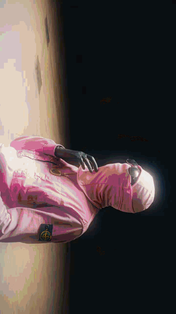 a painting of a person wearing a pink shirt and a mask