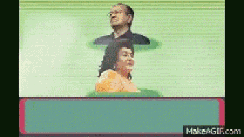 a man and a woman are standing next to each other on a green background .