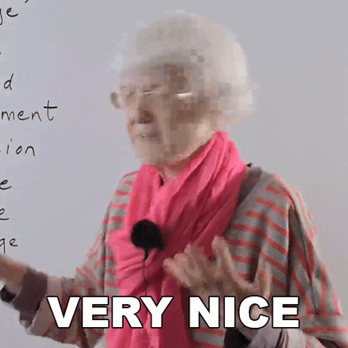 an elderly woman wearing a pink scarf and glasses says very nice