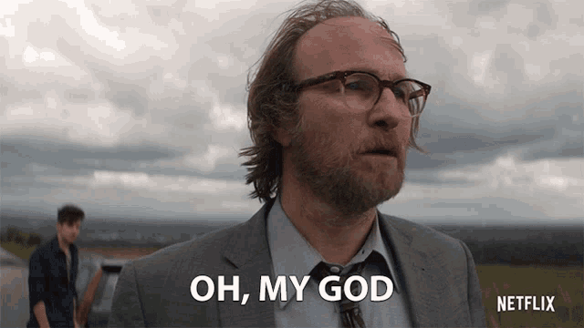 a man in a suit says oh my god in front of a netflix logo