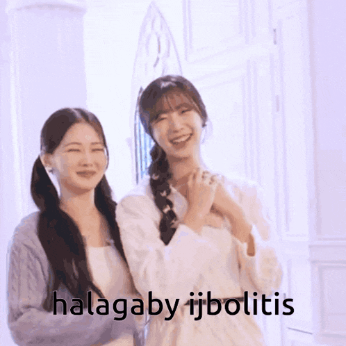 two girls are standing next to each other with the words halagabo ijbolitis written on the bottom