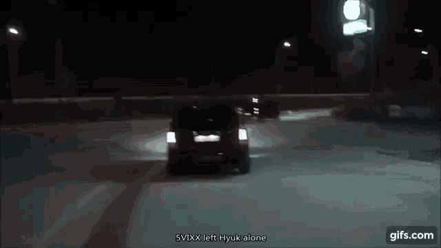 a car is driving down a snowy road at night and says svxx left hyuk alone on the bottom