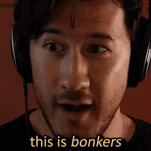 a man wearing headphones says " this is bonkers " on the bottom