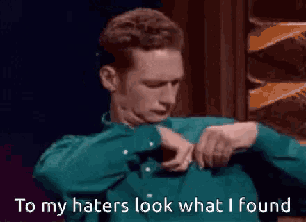 a man in a green shirt says to his haters look what he found