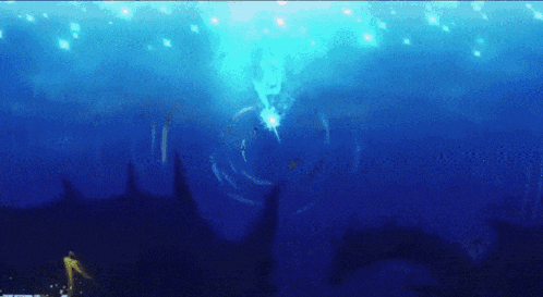 a person is swimming in the ocean with a shark in the background