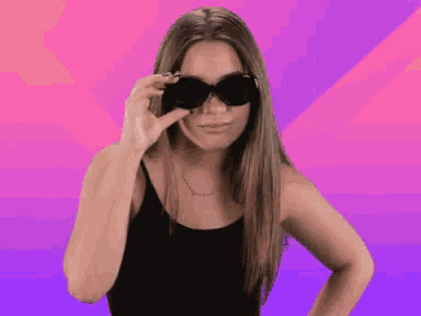 a woman wearing sunglasses says " do n't " on a purple and pink background