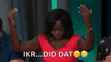 a woman in a red dress is raising her arms in the air and says ikr did dat .