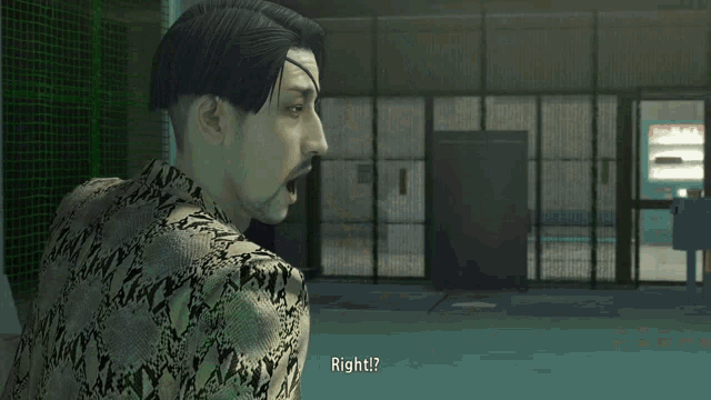 a man in a snakeskin suit is standing in front of a green fence and talking to another man .