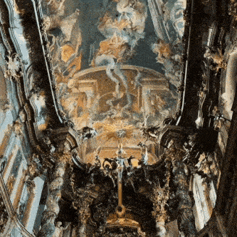 a church with a painting on the ceiling and a cross on the altar