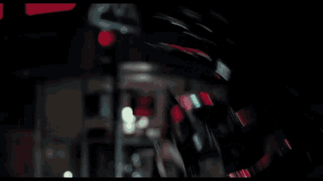 a woman in a catwoman costume holds a knife