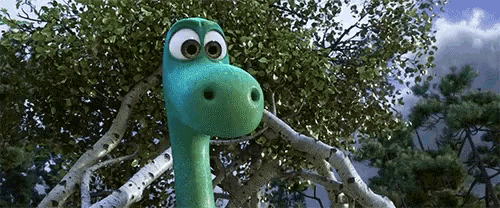 a cartoon dinosaur is standing in a tree looking at the camera