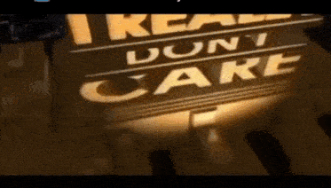 a sign that says `` i really don 't care '' is lit up in a dark room .