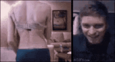 a woman 's back with a tattoo on it and a man 's face .