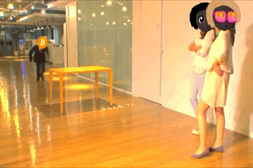 a person with a b on their head standing next to a woman