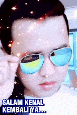 a man wearing sunglasses with the words salam kenal kembali ya written below him