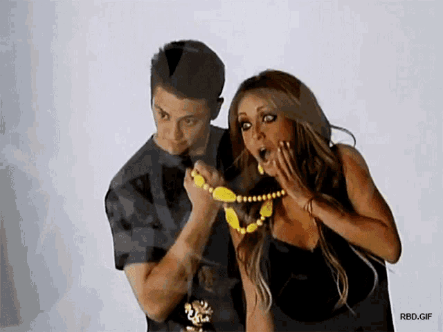 a man and a woman are standing next to each other in a gif that says rbd.gif at the bottom