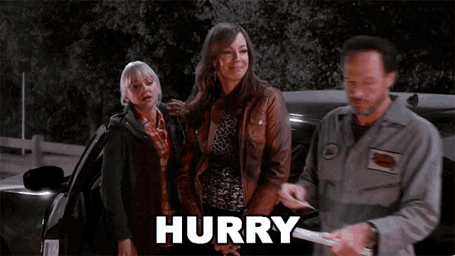 a group of people standing in front of a car with the word hurry written on the screen