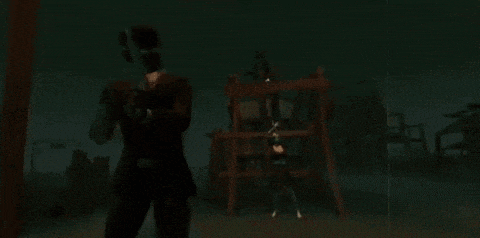 a man in a suit is holding a gun in front of a playground