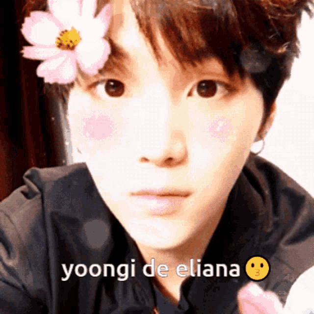 a close up of a person 's face with the words yoongi de eliana written below it