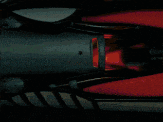 a close up of a red object with a circle in the middle