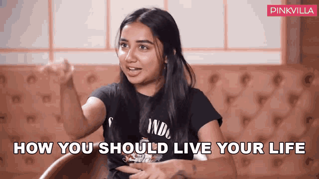 a woman sitting in a chair with the words " how you should live your life " written above her
