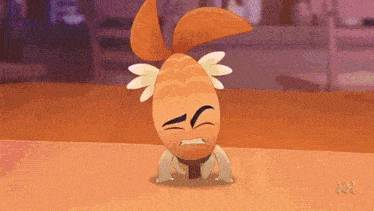a cartoon character is laying on its back on a table with a sad face .