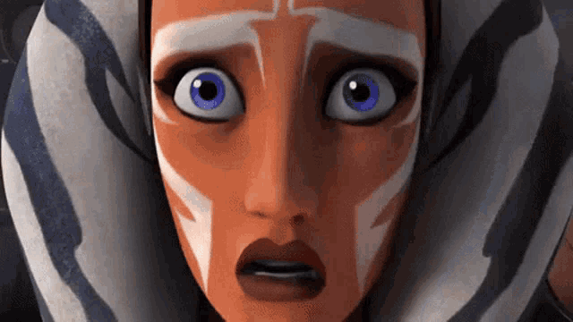a close up of a cartoon character 's face with a surprised expression .