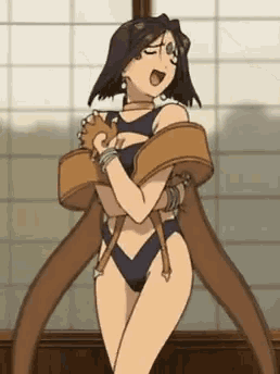 a woman in a swimsuit is tied up with a brown belt