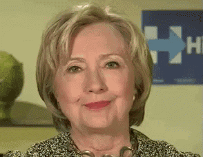 a close up of a woman 's face with a blue arrow pointing to the right