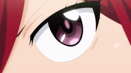 a close up of a person 's eye with a purple pupil