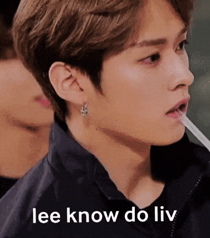 a close up of a person 's face with a straw in their mouth and the words lee know do liv .