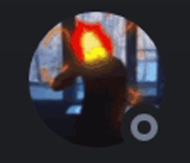 a person with a fireball on their head is in a circle .