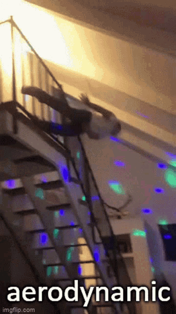 a man is falling down a set of stairs with the word aerodynamic written on the bottom