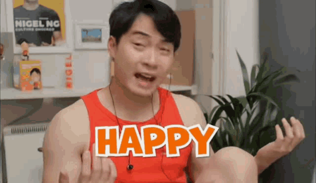 a man is wearing a red tank top that says happy on it