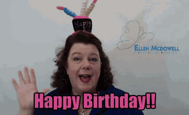a woman wearing a cake headband says happy birthday