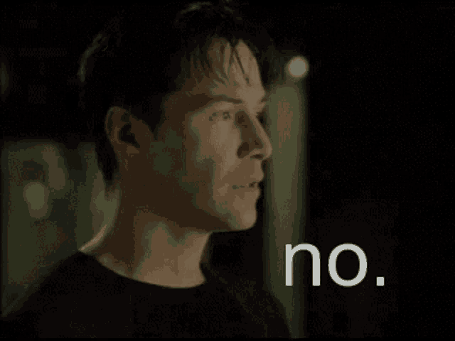 a man in a black shirt says no in white