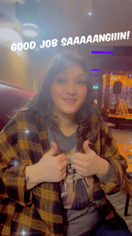 a woman in a plaid shirt is giving a thumbs up with the words good job saaaaangiiiing behind her