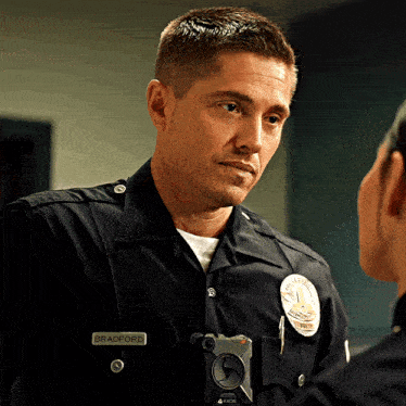 a police officer named bradford talks to another police officer