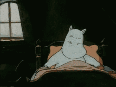 a cartoon character is laying in a bed with his head on a pillow .