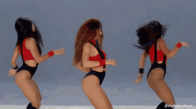 a group of women are dancing with one wearing a headband that says ' i love you '