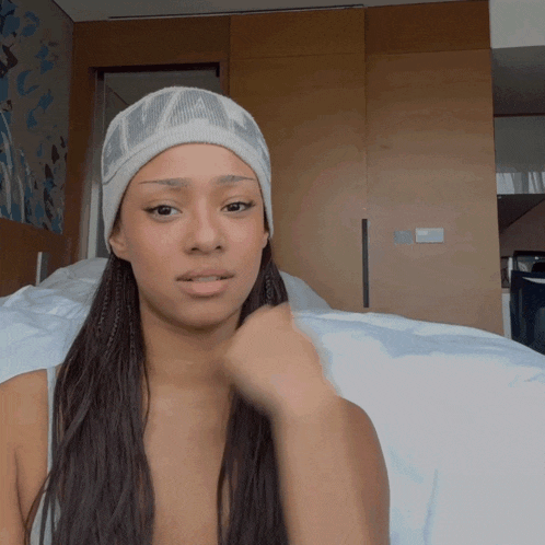 a woman wearing a white headband with the word ufc on it
