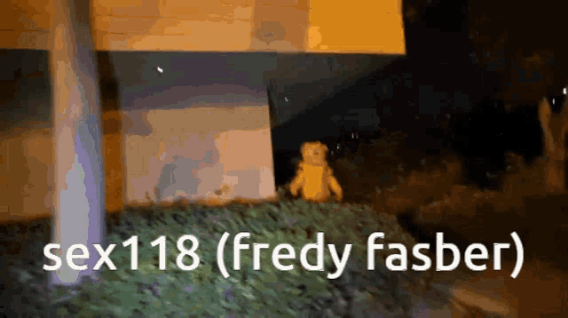 a teddy bear standing in front of a building with the words sex118 ( fredy fasber )