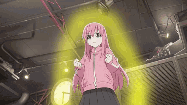 a girl with pink hair stands in front of a yellow light