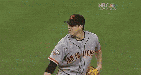 a man wearing a san francisco giants baseball jersey
